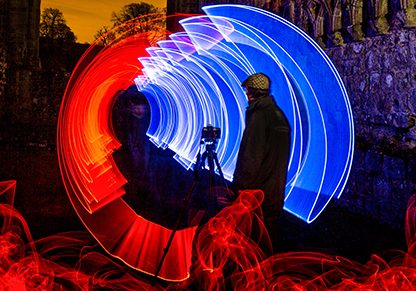 Tripping the Light Fantastic - A photorapher captures the Historic Bolton Abbey Priory surrounded by a kaleidoscope of colours .